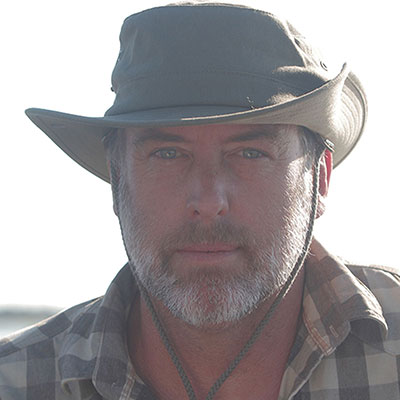The Adventurer Flat Packable Hat by The Safari Store worn in Chobe National Park